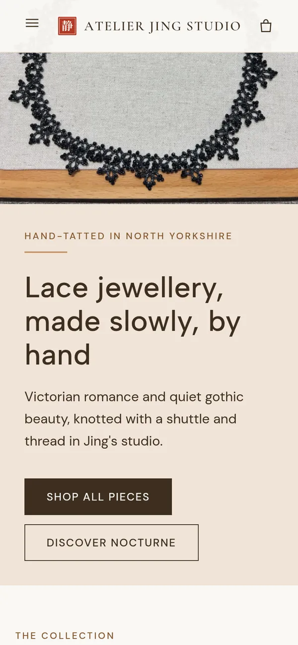 The Atelier Jing Studio shop on a phone, with the lace collar above the headline and the "Shop all pieces" button